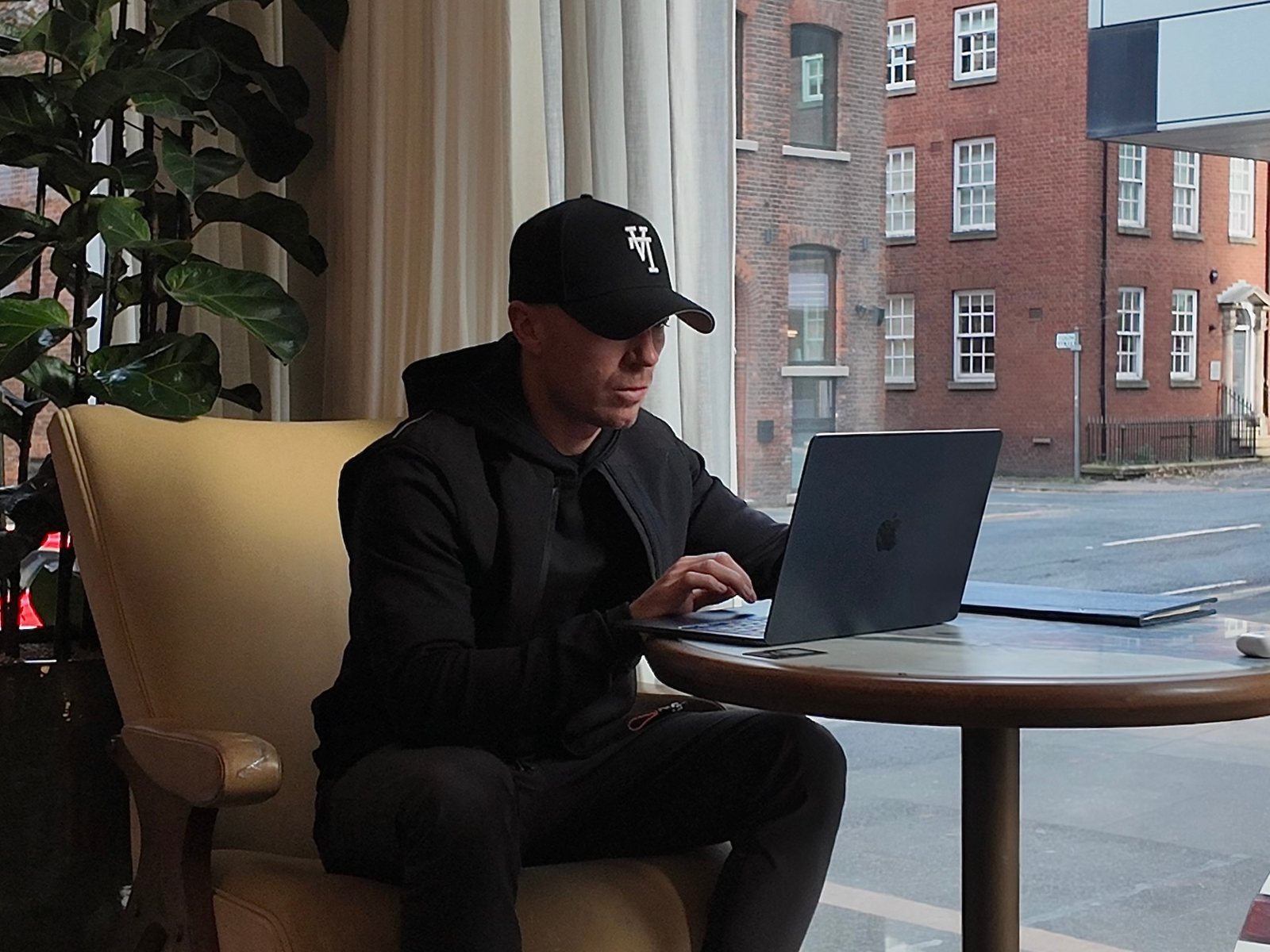 Ben trading at his laptop